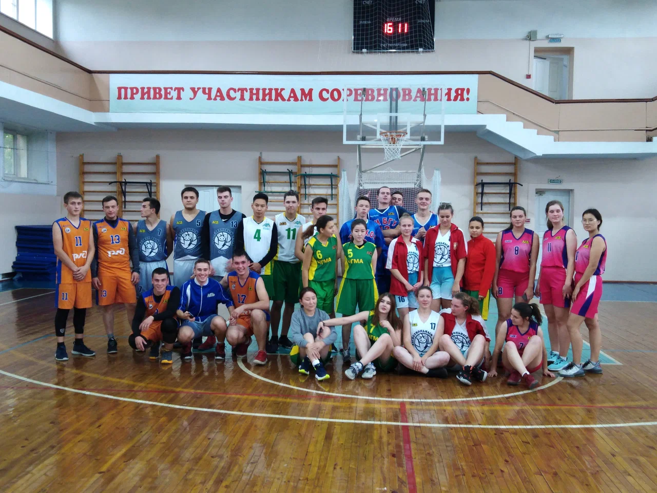 Students and participants gathered in an indoor sports hall